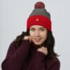 pom-pom-knit-cap-dark-heather-grey-red-front-693be9744c80e.jpg Enigmina